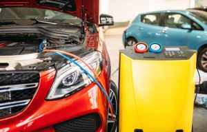 A car's air conditioning system being repaired in a shop near Indianapolis, Indiana
