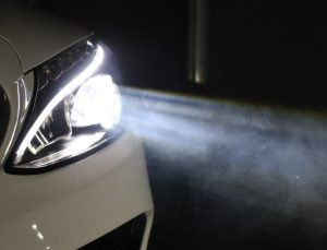 A headlight shining in a dark area near Indianapolis, Indiana