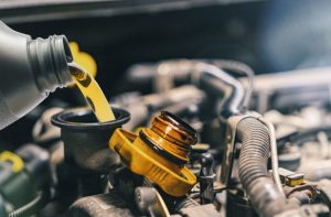 An oil change being performed at an auto service center near Indianapolis, Indiana.