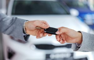 A person receiving a key to their new car near Indianapolis, Indiana