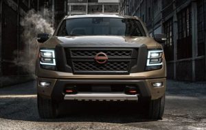 A front view of a 2024 Nissan Titan parked indoors near Indianapolis, Indiana