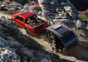 A 2024 Nissan Frontier hauling a small trailer through a rocky terrain near Indianapolis, Indiana