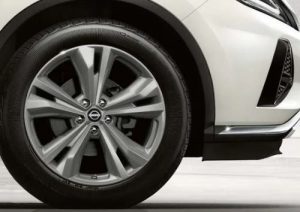 A close-up photo of the side of a white 2024 Nissan Murano, parked near Indianapolis, Indiana