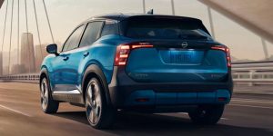 Blue 2025 Nissan Kicks driving across bridge near Indianapolis, IN