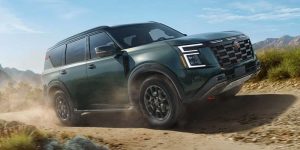 2026 Nissan Armada driving off-road in a desert landscape.