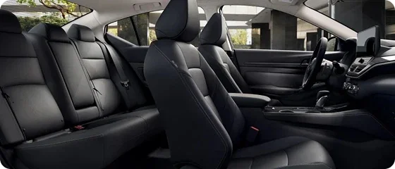 Interior of the 2026 Nissan Altima SV showing both rows of black cloth seats and the dashboard