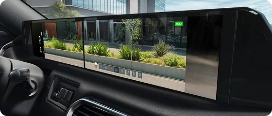Nissan Armada touchscreen displaying front and side camera views of a city street