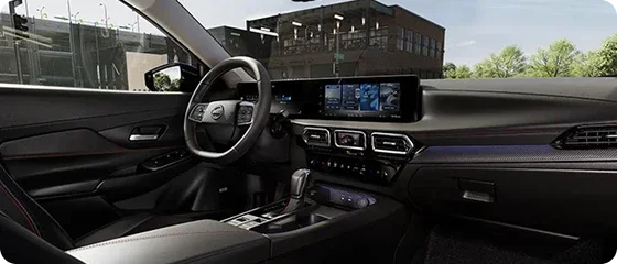 Driver's side interior of the 2026 Nissan Sentra SV showing the steering wheel, 12.3-inch NissanConnect touchscreen and center console