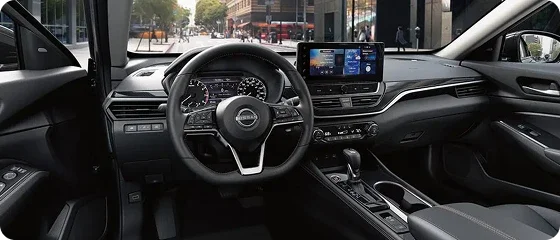 Driver's side dashboard of the 2026 Nissan Altima SV showing the steering wheel, instrument display and 8-inch touchscreen