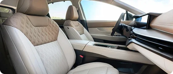 Interior of the 2026 Nissan Murano Platinum AWD showing quilted cream semi-aniline leather-appointed front seats and the dashboard