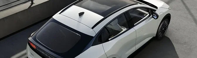 Overhead view of a white 2026 Nissan LEAF parked, showing its roof and glass