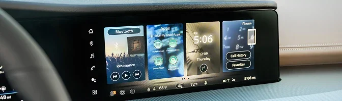 Close-up of the Murano's wide center display showing audio, apps and phone tiles