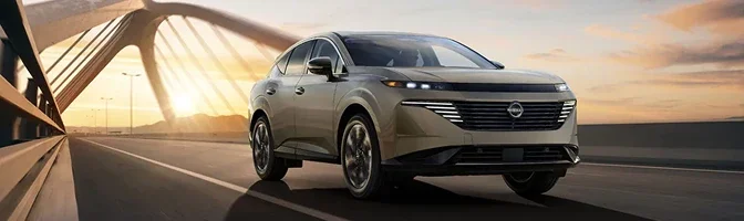 Beige 2026 Nissan Murano crossing a bridge at sunset