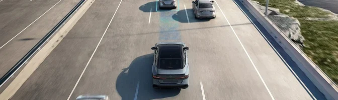 Overhead view of a Sentra on the highway with its driver-assistance sensing shown